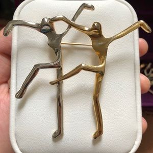 Dancing people brooch